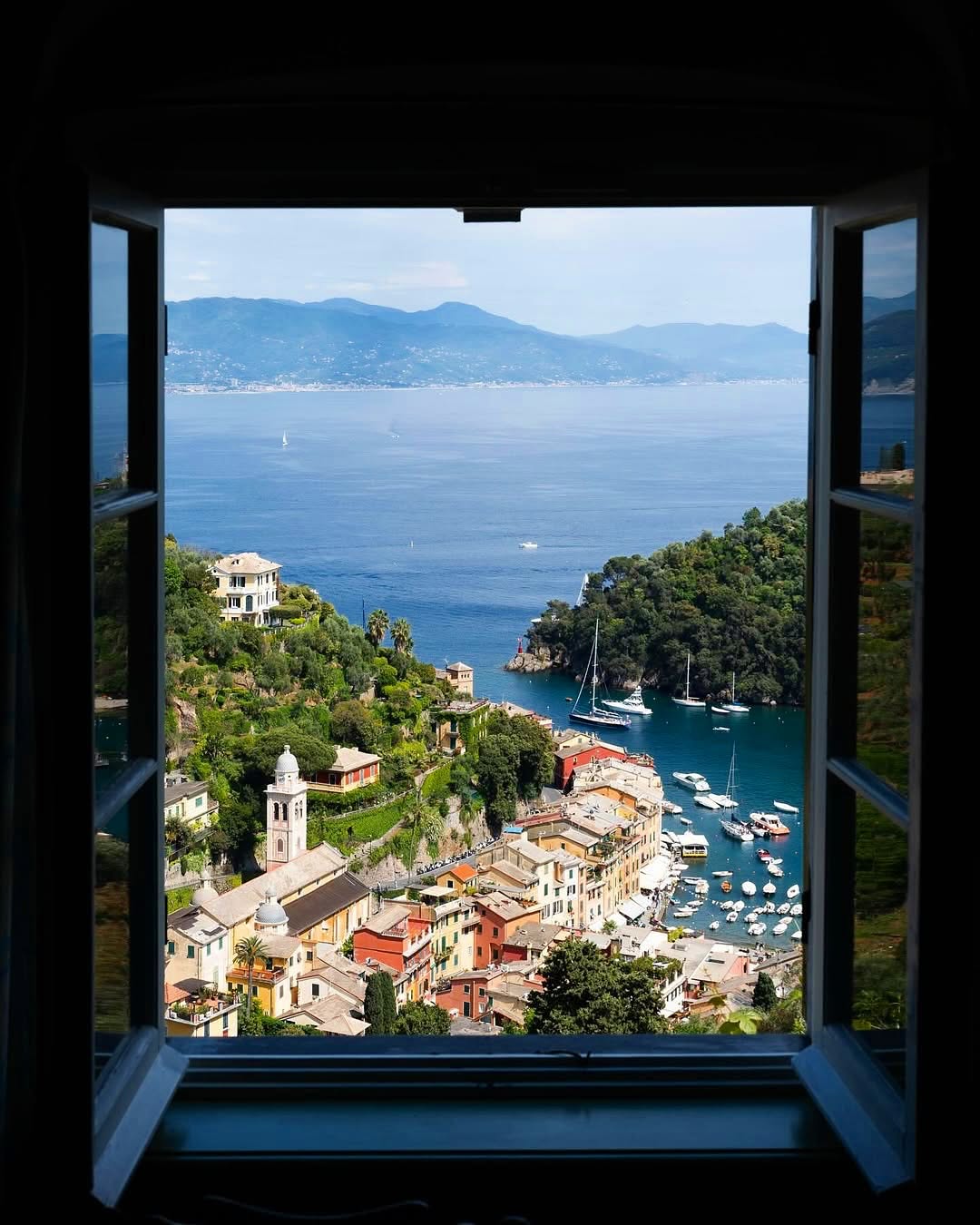 Window framing the Portofino harbour