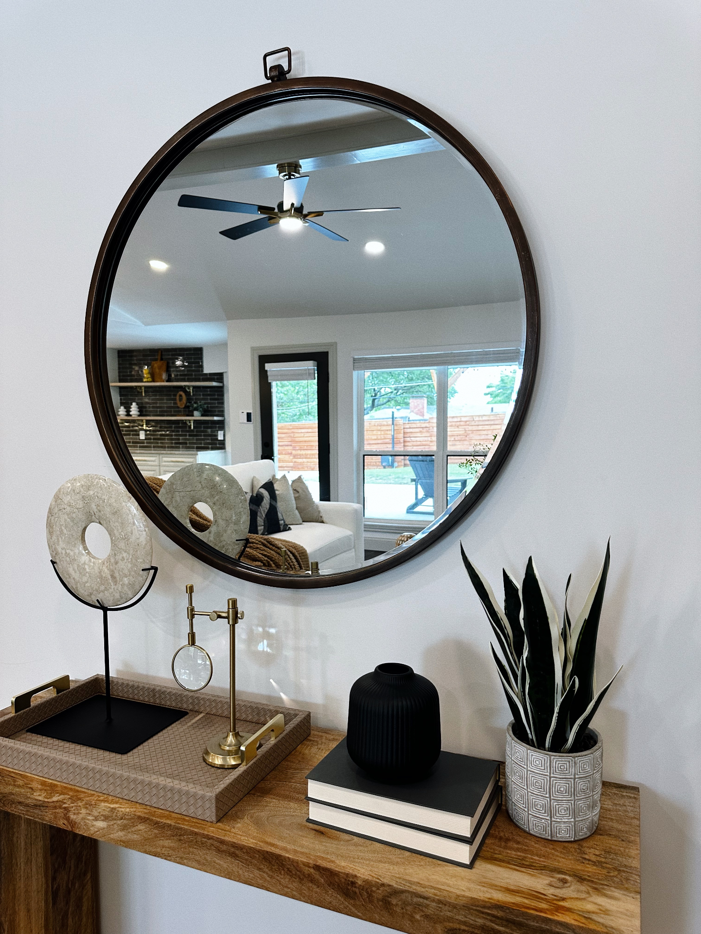 Console vignette with vintage mirror